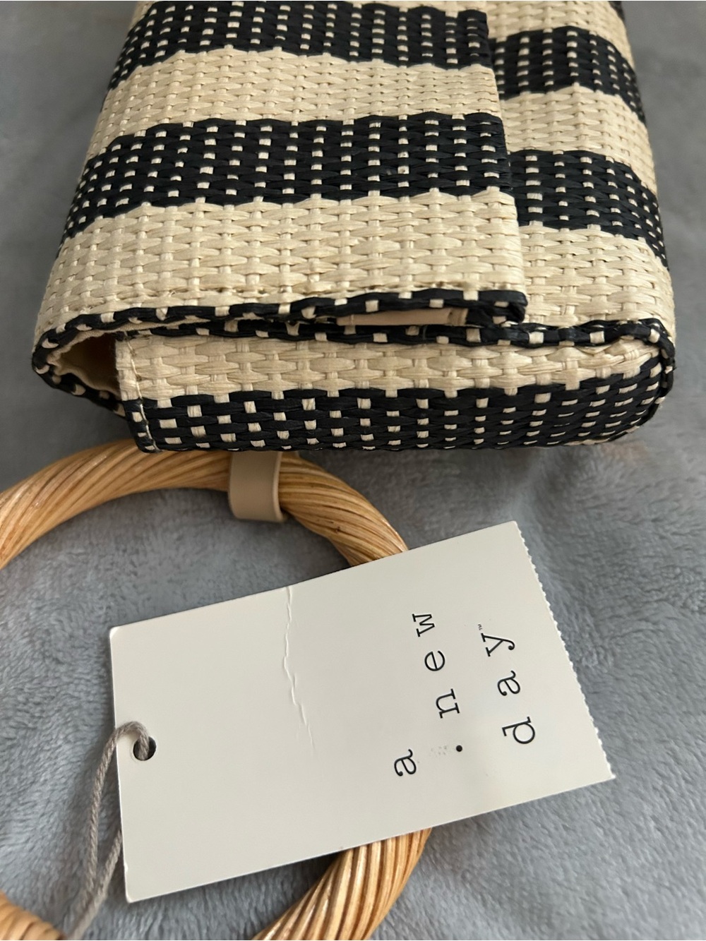 a • new day
Woven Straw Wristlet Bag in Black and Natural